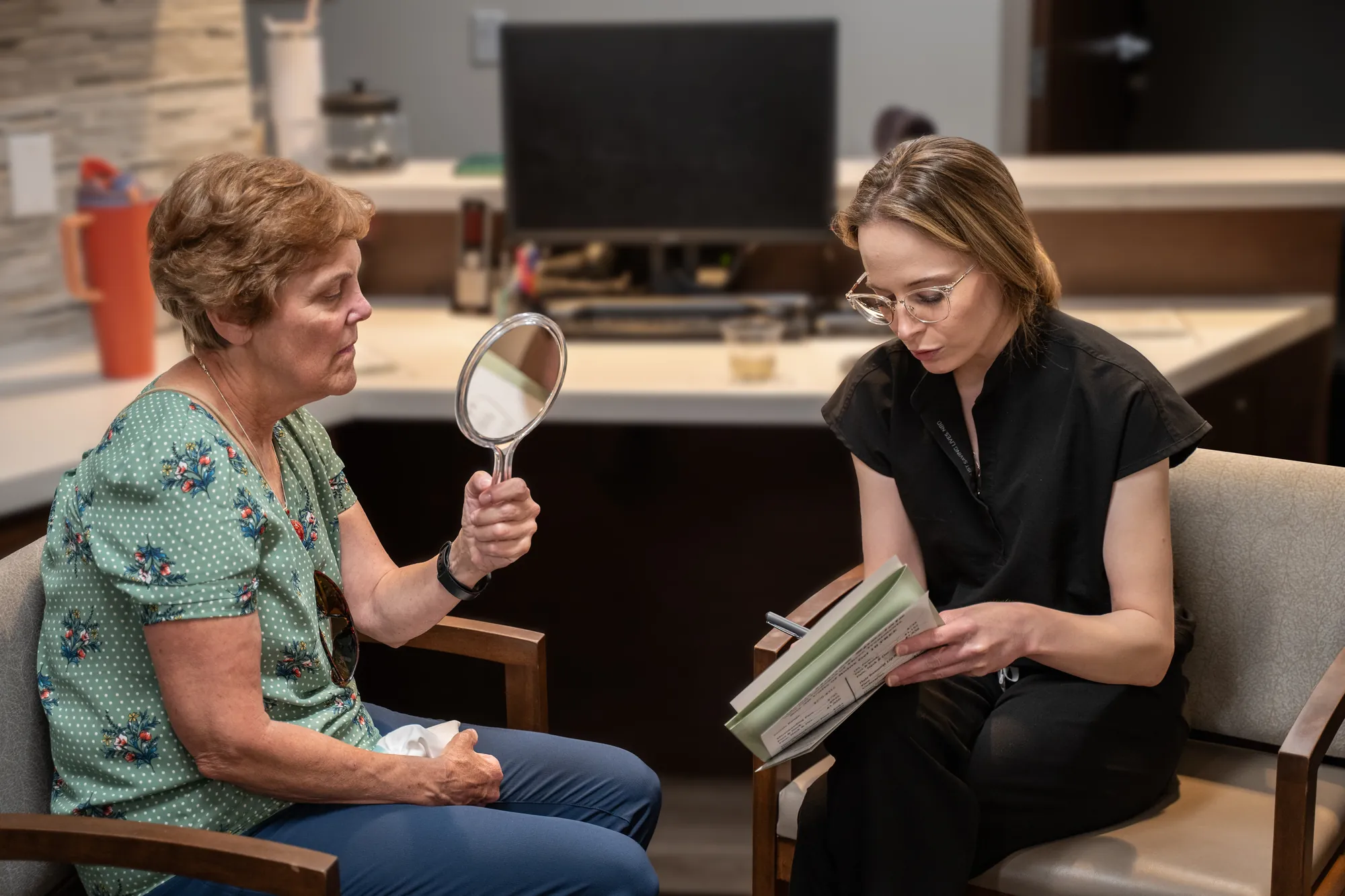 IRIS Aesthetics provider reviewing a personalized treatment plan with a patient