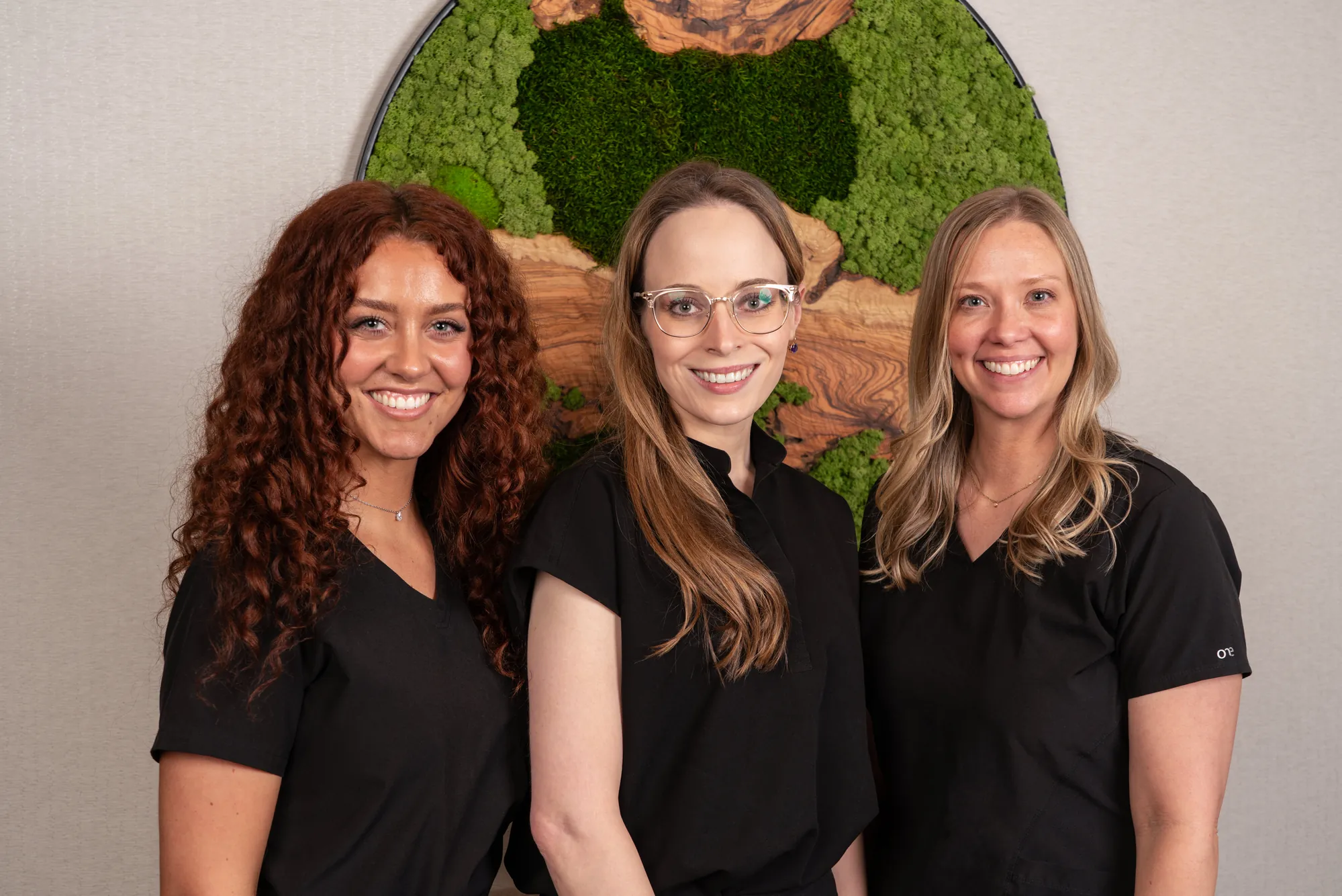 The IRIS Aesthetics team — Brooke Aragon L.E., Dr. Adrianna Jensen MD, and Caitlyn Chappell FNP-C